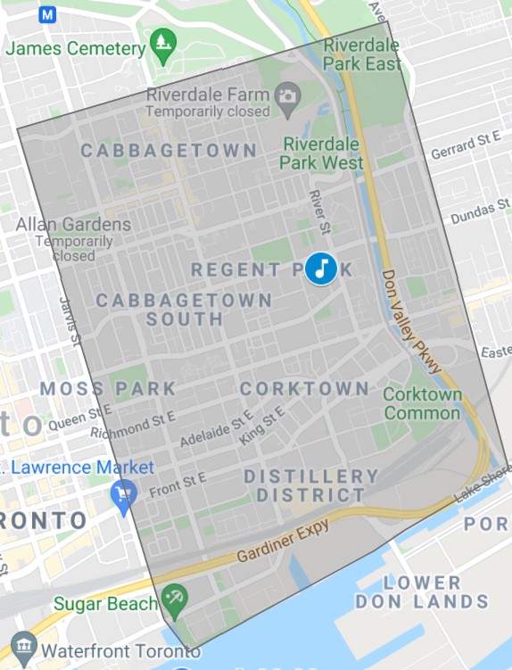 A map highlighting the Regent Park area in Toronto, including surrounding neighborhoods such as Cabbagetown, Corktown, and the Distillery District. A blue musical note icon is placed within Regent Park. Major roads, parks, and landmarks like Riverdale Park and Sugar Beach are visible.