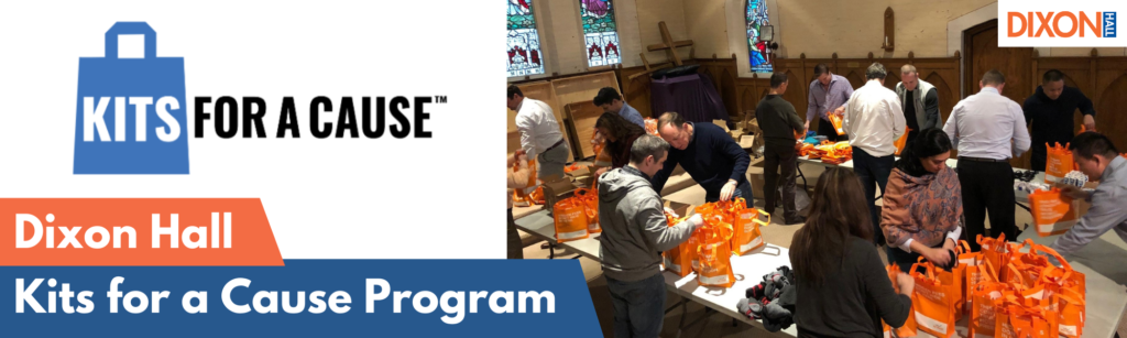 a-group-of-people-gathers-in-a-church-hall-assembling-orange-care-kits-for-the-kits-for-a-cause-program-by-dixon-hall-the-event-banner-and-logo-are-displayed-on-the-image-